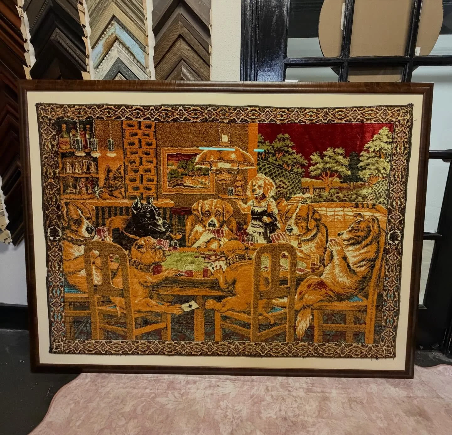 Vintage dogs-playing-cards tapestry stretched and framed in warm walnut